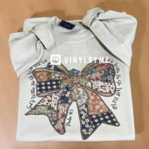 Tan God is within her sweatshirt